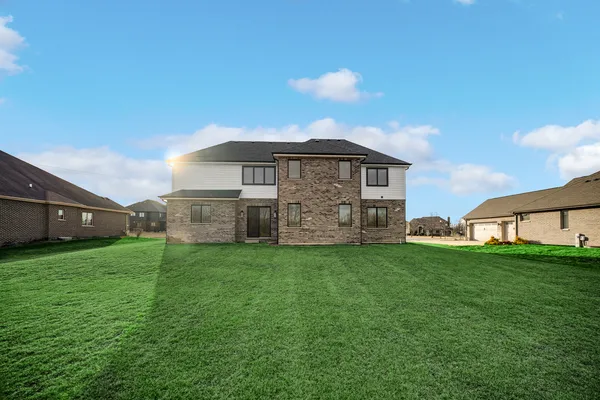 an aerial view of a house with a garden