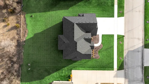 a view of field with grass and trees