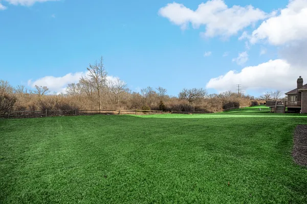 a house view with a big garden