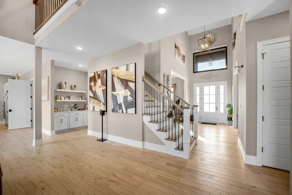 a view of a livingroom with wooden floor and windows