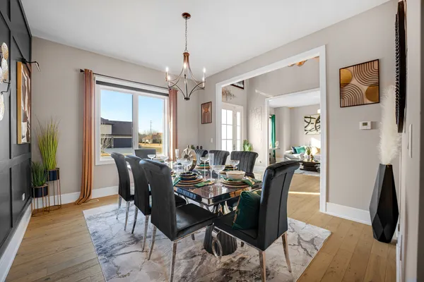 a view of a dining room with furniture and wooden floor