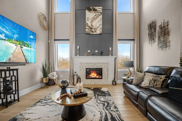 a living room with furniture and a fireplace