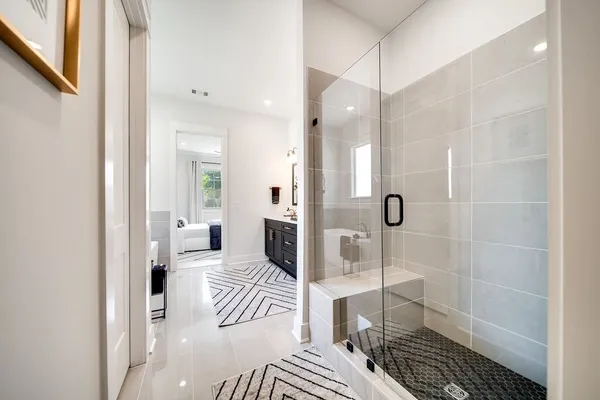 a spacious bathroom with a double vanity sink double vanity and mirror