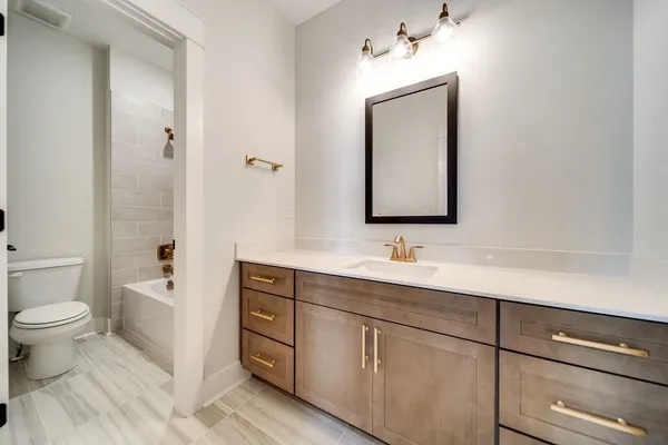 a stove top oven sitting inside of a kitchen