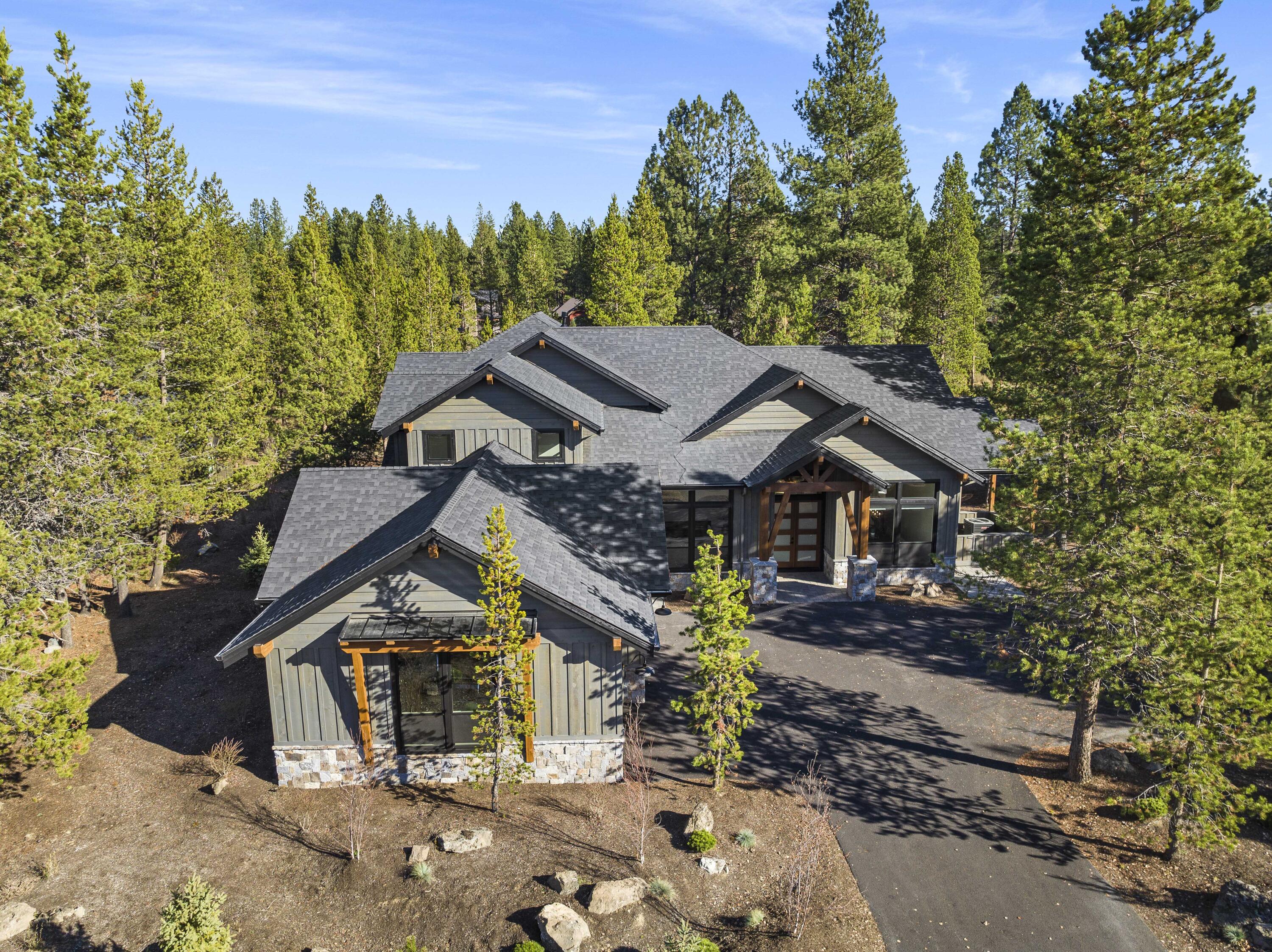 56500 Sunstone Loop, Unit 161 Bend, OR 97707 - Photo 2 of 64 Nestled among majestic pine trees, enjoy the peacefulness of this beautiful home.