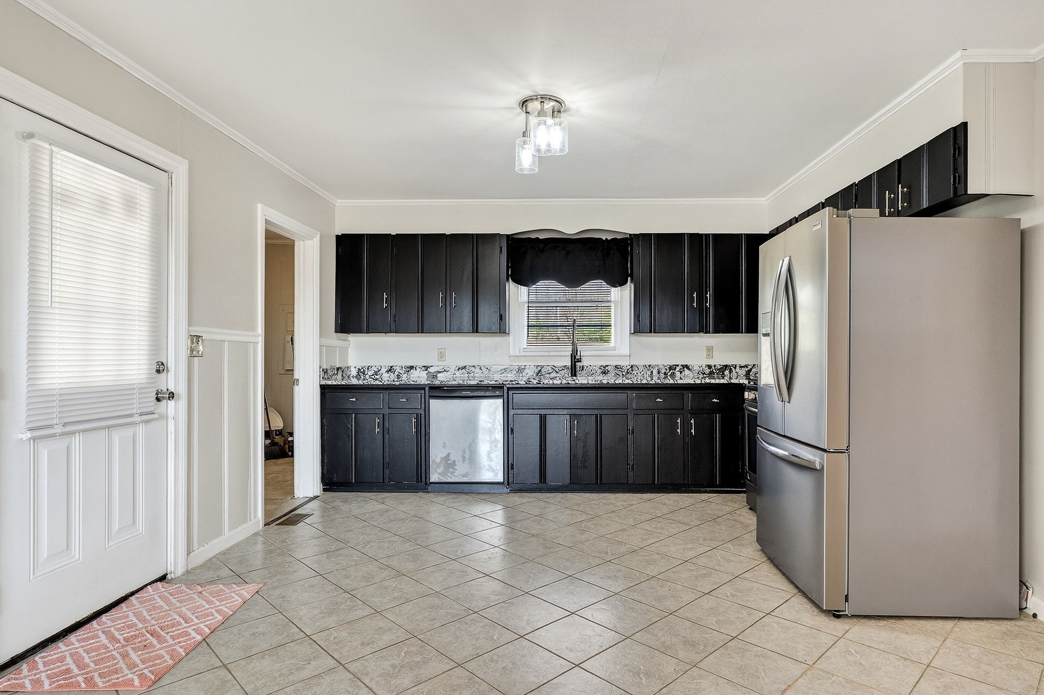 111 Roosevelt Road McMinnville, TN 37110 - Photo 8 of 27 a large kitchen with a refrigerator and a stove top oven