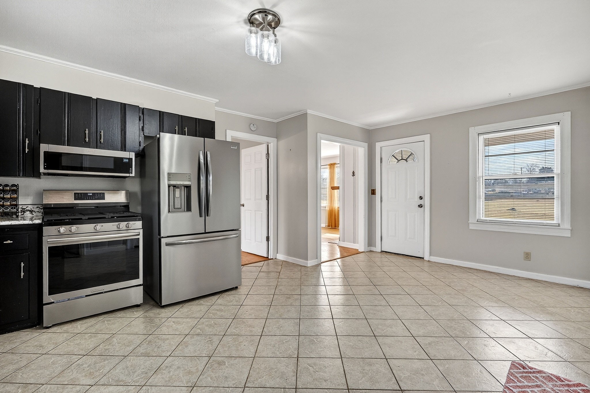 111 Roosevelt Road McMinnville, TN 37110 - Photo 10 of 27 a kitchen with stainless steel appliances a refrigerator and a stove top oven