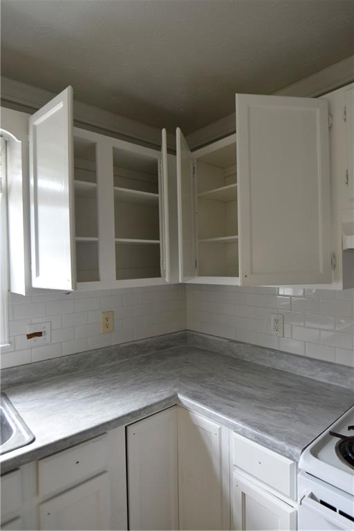 2898 Webb Bridge Road Alpharetta, GA 30009 - Photo 3 of 8 a view of an empty room with a cabinet