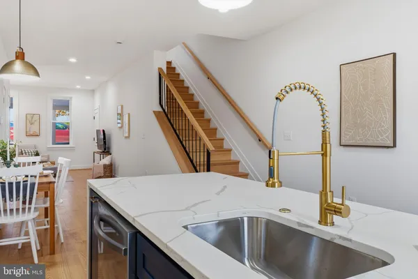 a view of a kitchen area and microwave