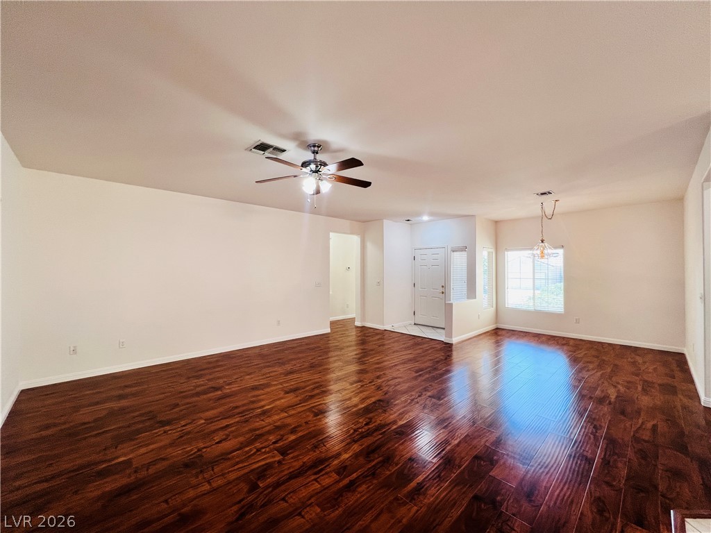 3047 Hickory Valley Road Henderson, NV 89052 - Photo 6 of 33 Rich hardwood floors welcome you into this spacious living area, ideal for relaxed entertaining.