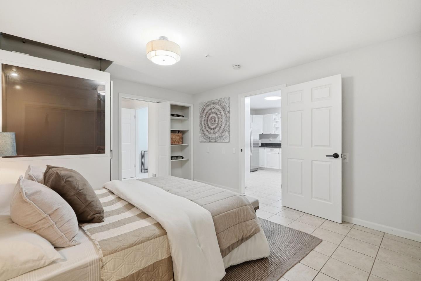 320 Angel Avenue Sunnyvale, CA 94086 - Photo 14 of 47 a bedroom with a bed and a mirror