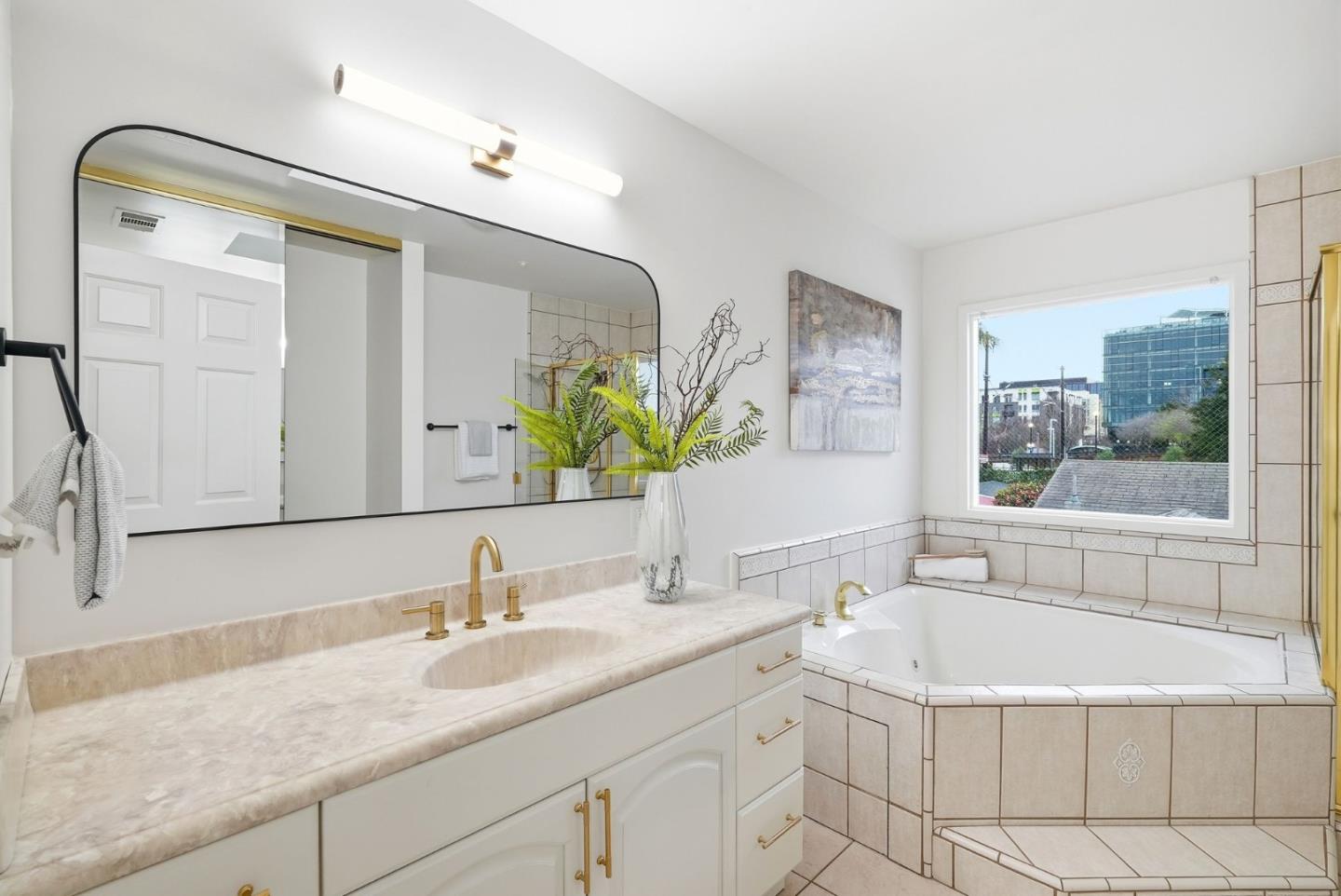 320 Angel Avenue Sunnyvale, CA 94086 - Photo 16 of 47 a bathroom with a granite countertop sink mirror and bathtub