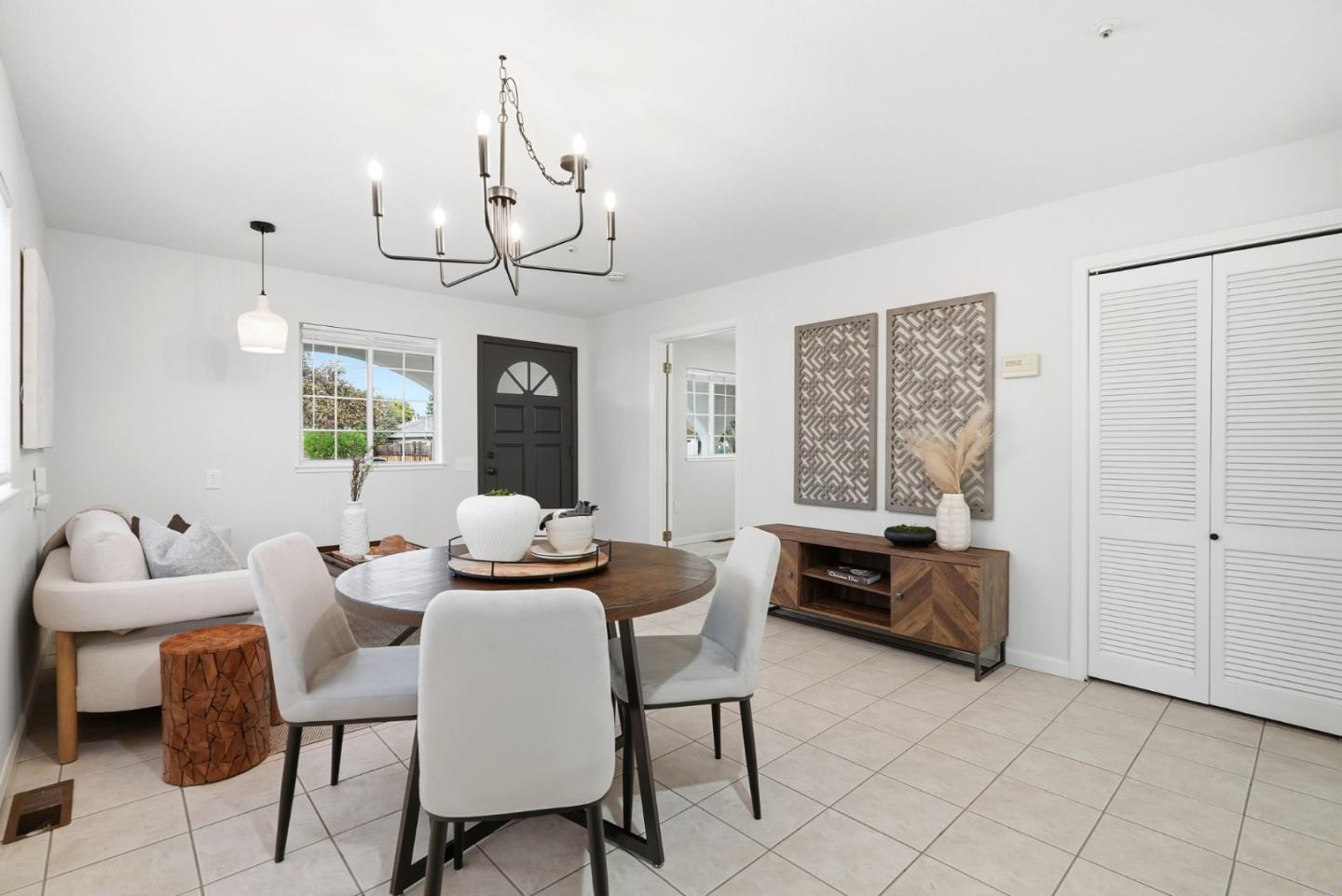320 Angel Avenue Sunnyvale, CA 94086 - Photo 8 of 47 a dining room with furniture a chandelier and a rug