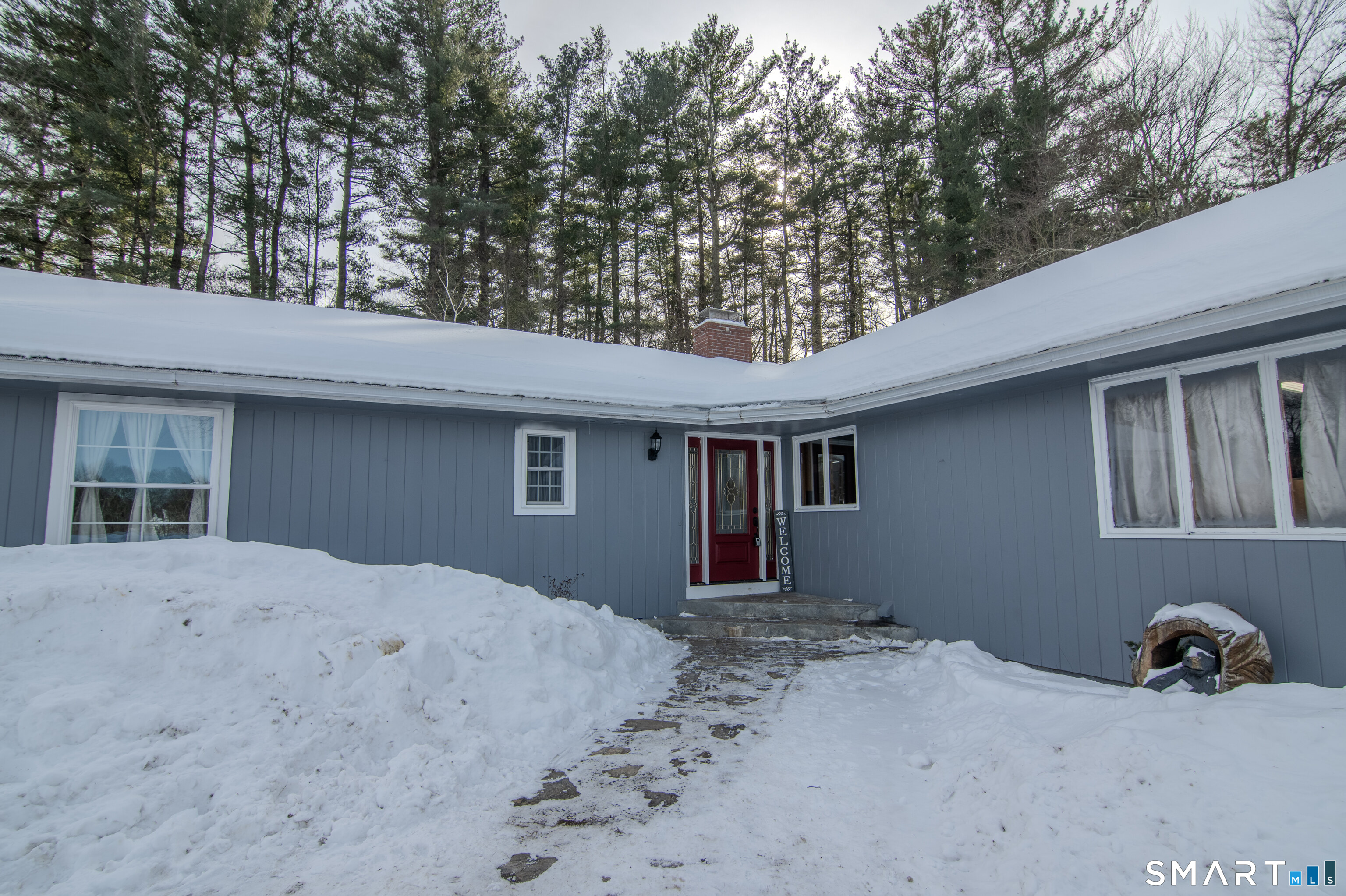 310 Roseland Park Road Woodstock, CT 06281 - Photo 11 of 43 a front view of a house with yard and seating area