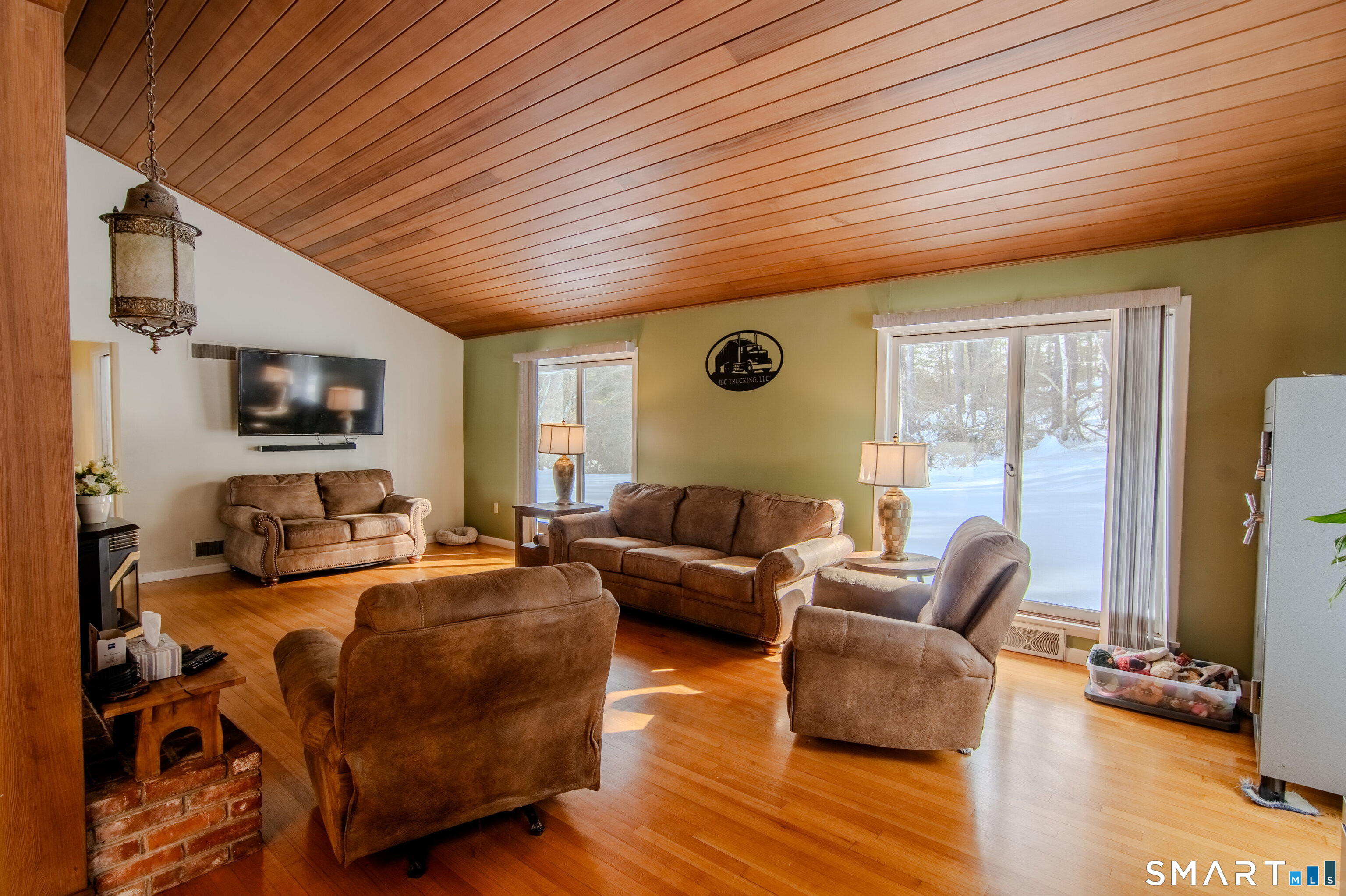 310 Roseland Park Road Woodstock, CT 06281 - Photo 20 of 43 a living room with furniture flat screen tv and large window
