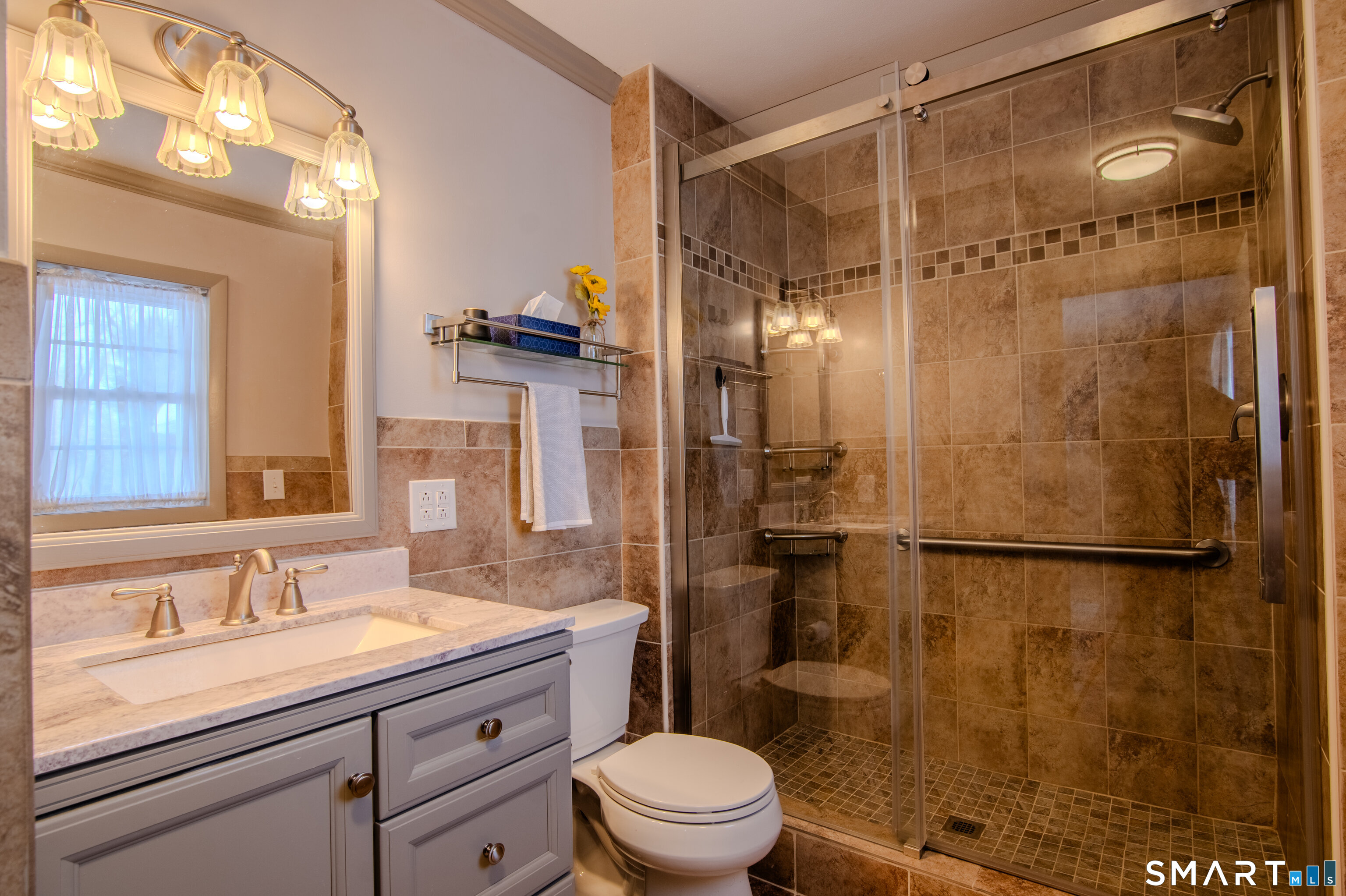 310 Roseland Park Road Woodstock, CT 06281 - Photo 27 of 43 a bathroom with a granite countertop sink toilet a shower and a mirror