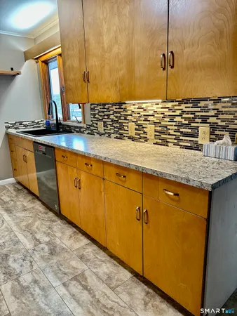a view of sink and mirror