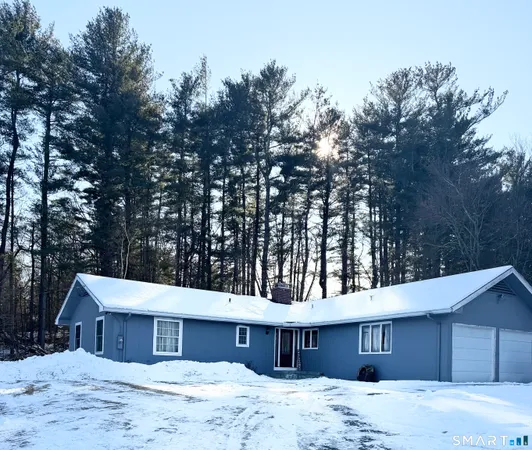 a house with trees in the background
