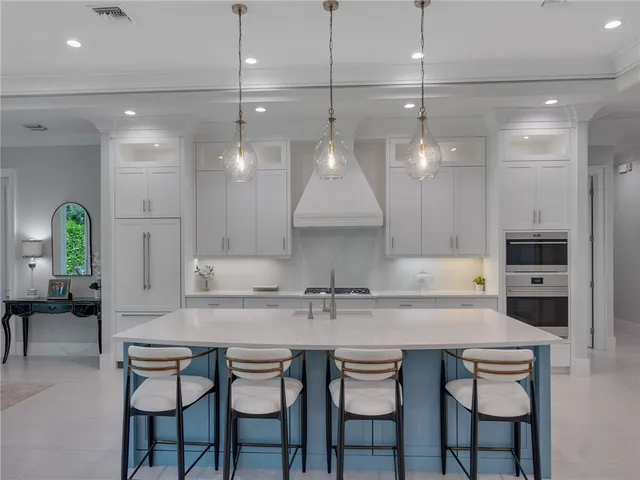 a kitchen with a sink cabinets and window