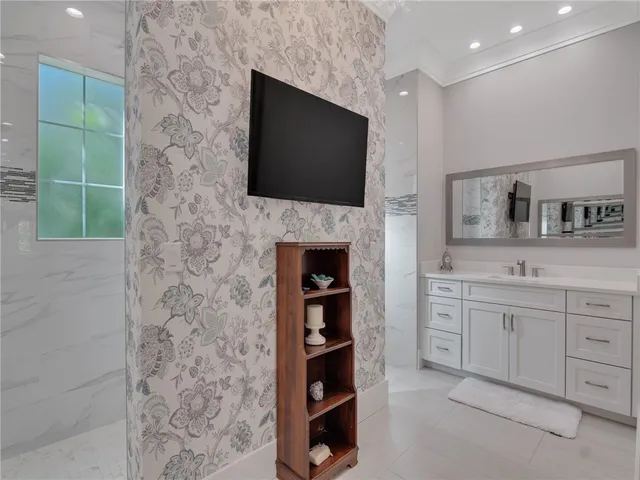 a living room with a fireplace and a flat screen tv