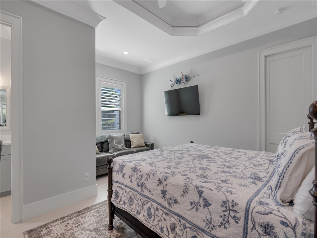 1025 Andarella Way Vero Beach, FL 32963 - Photo 26 of 36 a bedroom with a bed and a flat screen tv