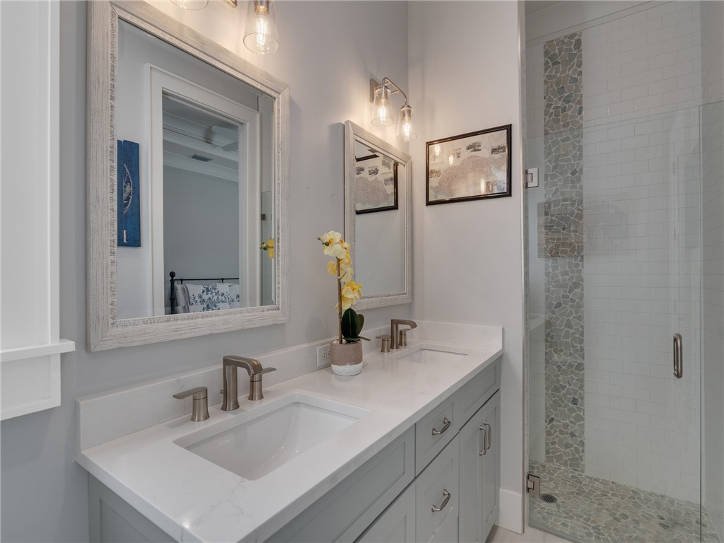 1025 Andarella Way Vero Beach, FL 32963 - Photo 27 of 36 a bathroom with a sink and a mirror