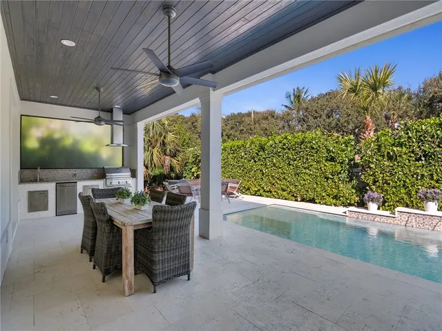 a view of a patio with table and chairs with wooden floor and outdoor space