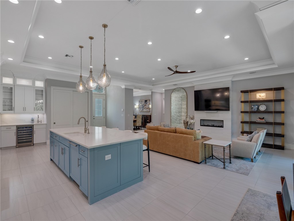 1025 Andarella Way Vero Beach, FL 32963 - Photo 4 of 36 a large living room with stainless steel appliances kitchen island granite countertop a large island in the center