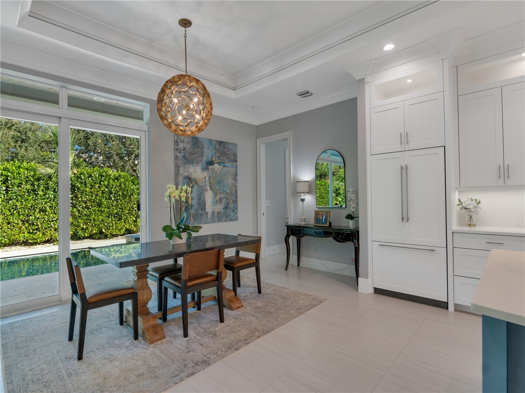 1025 Andarella Way Vero Beach, FL 32963 - Photo 8 of 36 a view of a dining room with furniture window and outside view