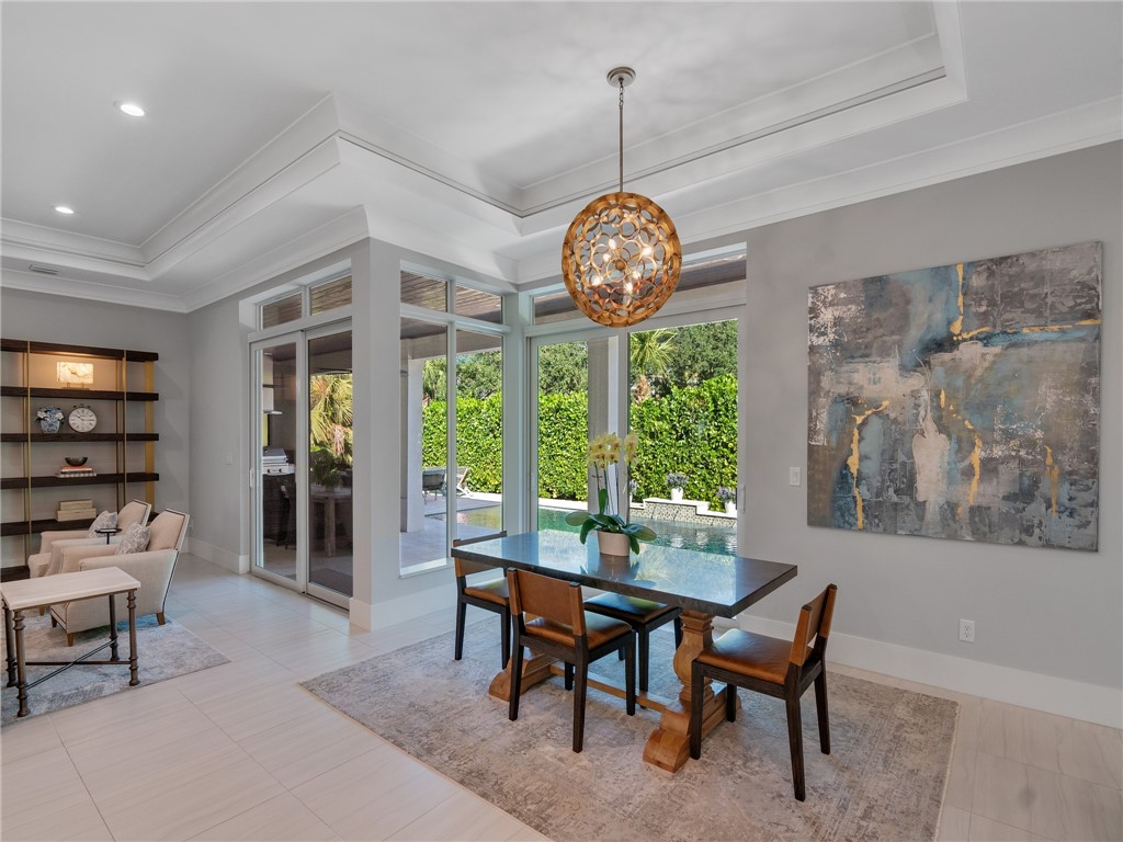 1025 Andarella Way Vero Beach, FL 32963 - Photo 9 of 36 a view of a dining room with furniture window and outside view
