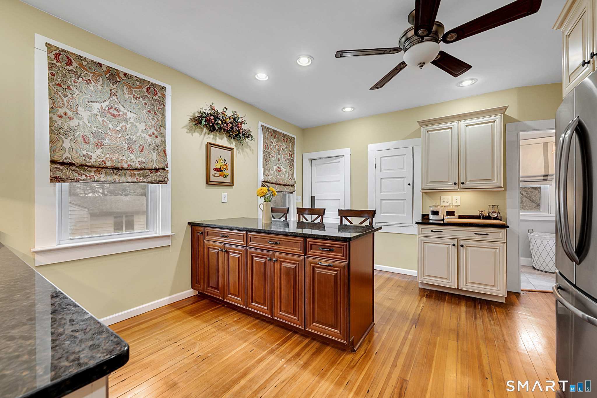 412 Reservoir Avenue Meriden, CT 06451 - Photo 11 of 32 a kitchen with stainless steel appliances granite countertop a stove cabinets and wooden floor