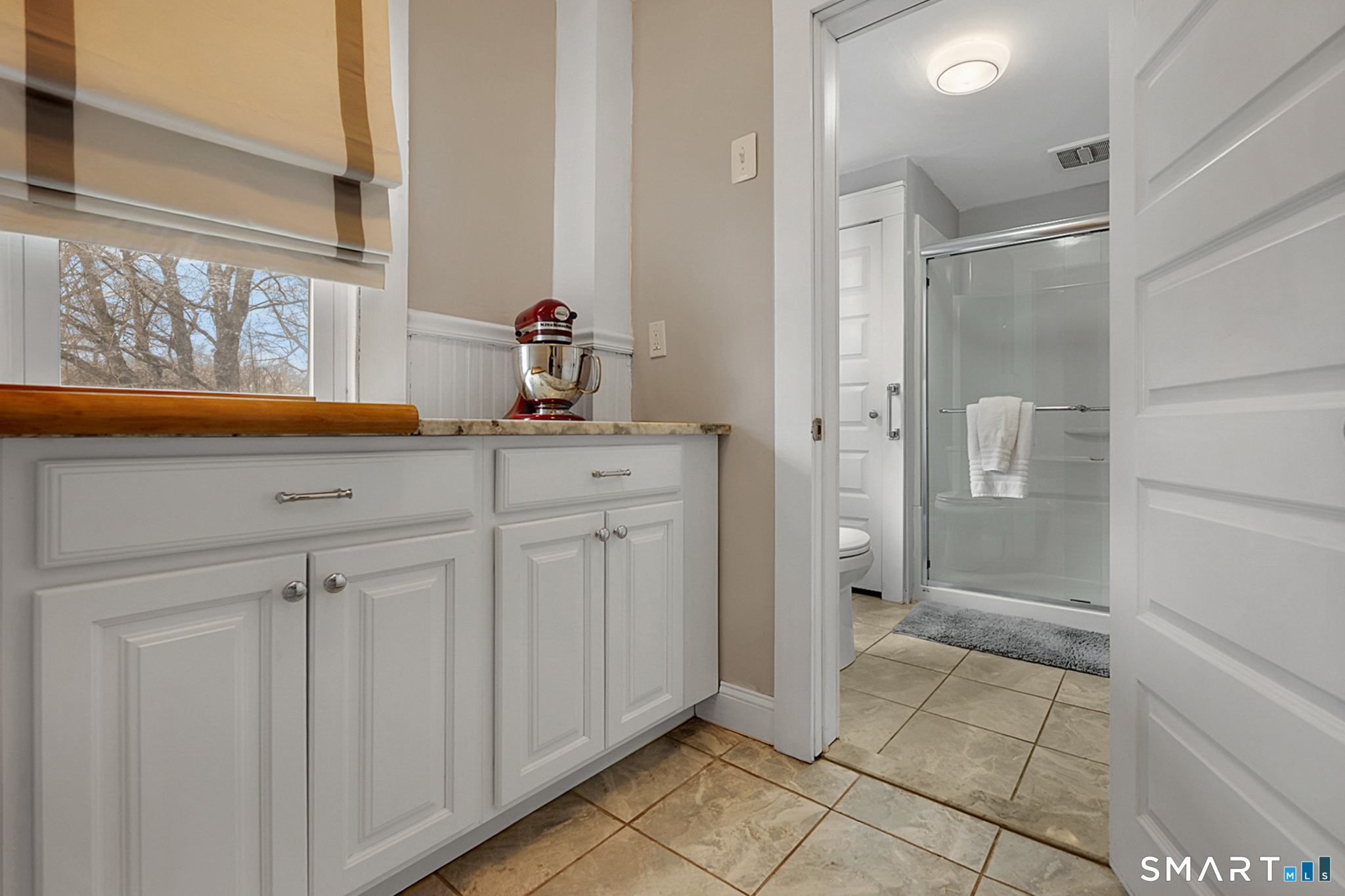 412 Reservoir Avenue Meriden, CT 06451 - Photo 13 of 32 a bathroom with a sink and a mirror