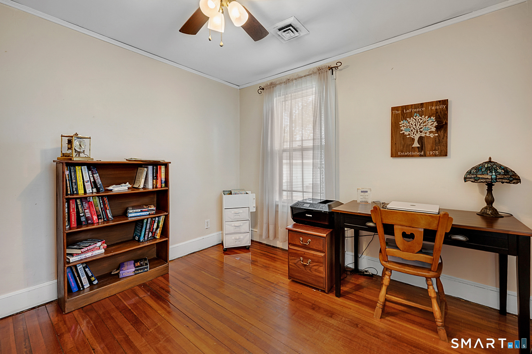 412 Reservoir Avenue Meriden, CT 06451 - Photo 17 of 32 a view of a workspace with furniture and wooden floor
