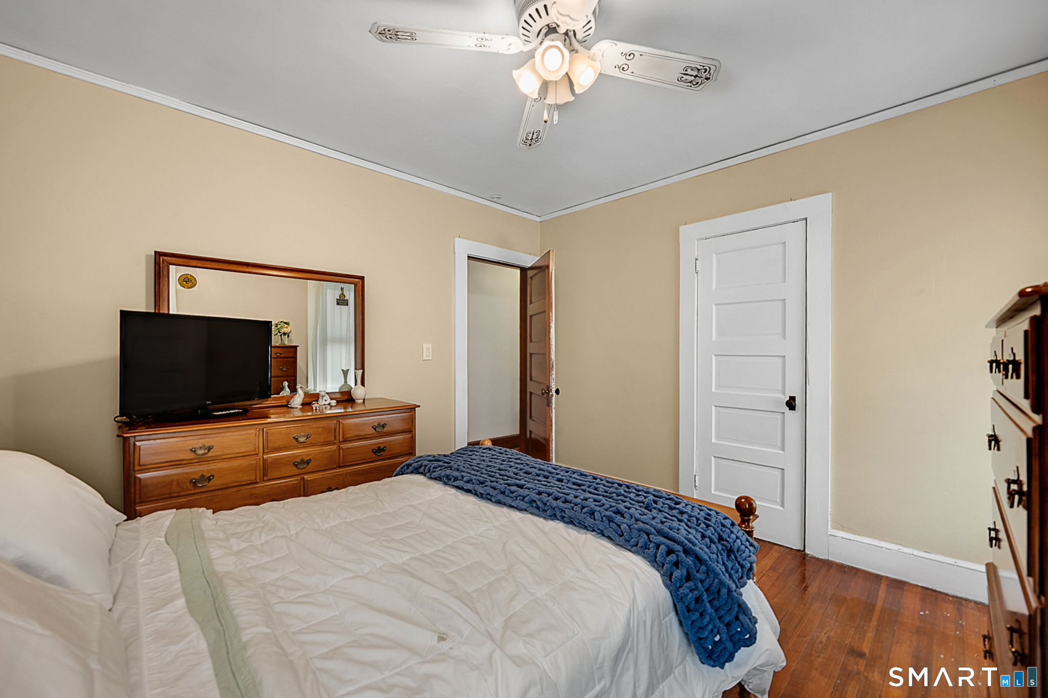 412 Reservoir Avenue Meriden, CT 06451 - Photo 18 of 32 a bedroom with a bed and a flat screen tv