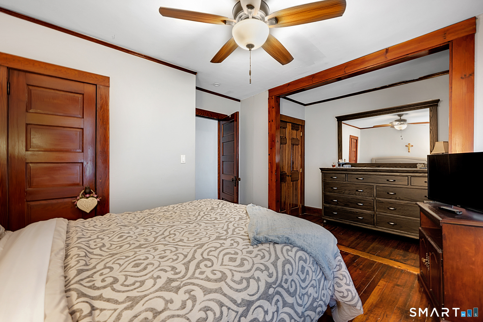 412 Reservoir Avenue Meriden, CT 06451 - Photo 20 of 32 a bedroom with a bed and a flat tv screen on dresser