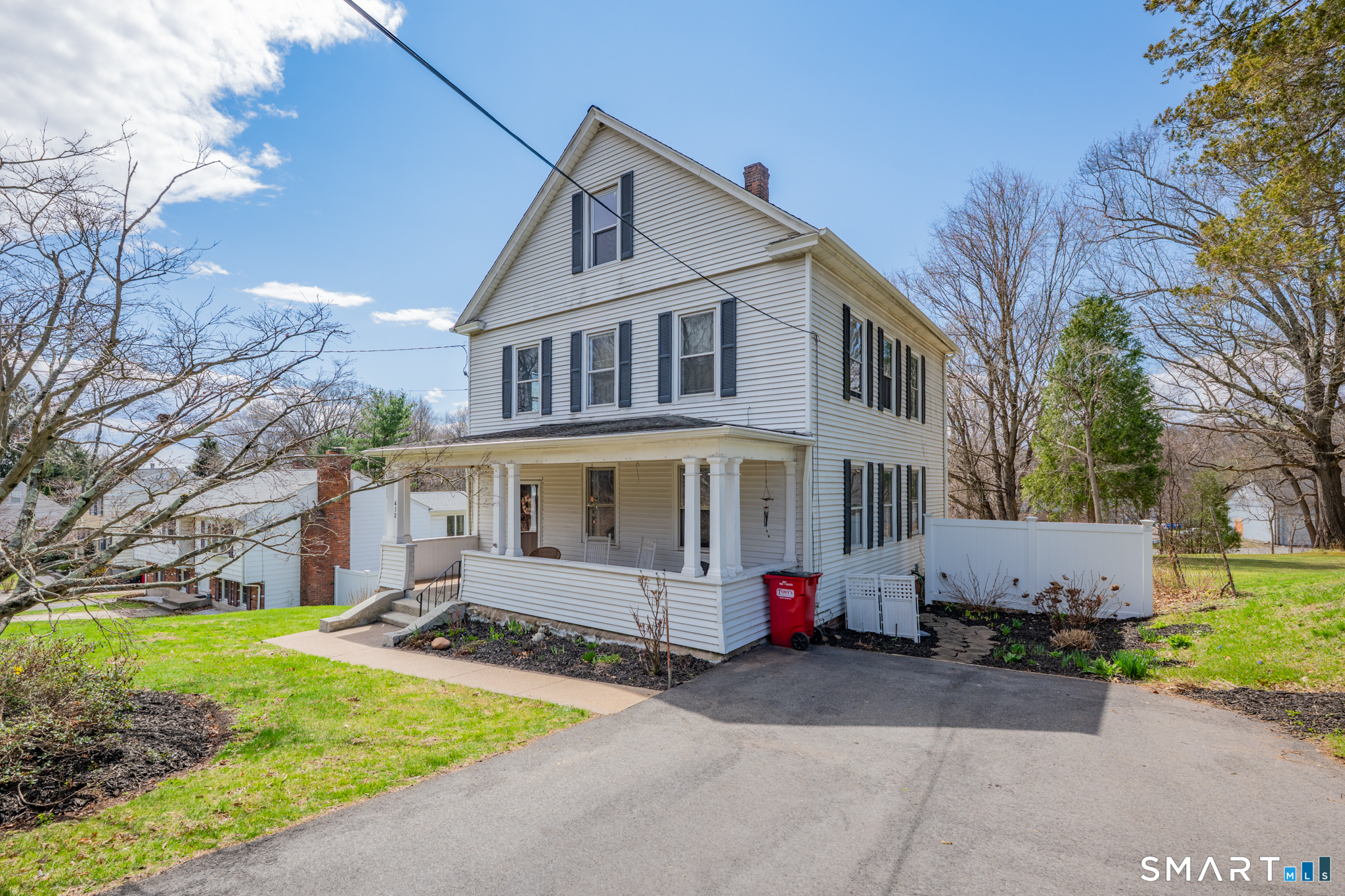 412 Reservoir Avenue Meriden, CT 06451 - Photo 2 of 32 a front view of a house with a garden and tree