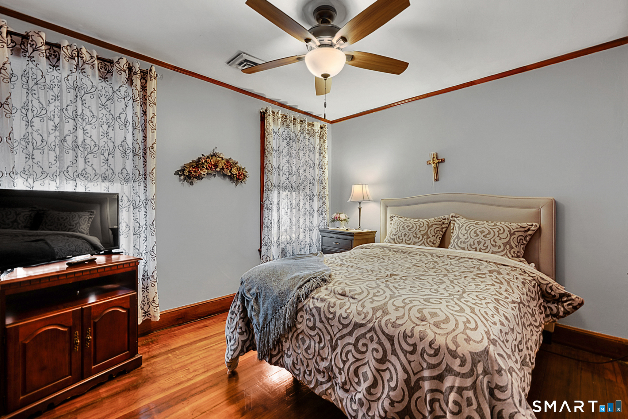 412 Reservoir Avenue Meriden, CT 06451 - Photo 21 of 32 a bedroom with a bed and a television