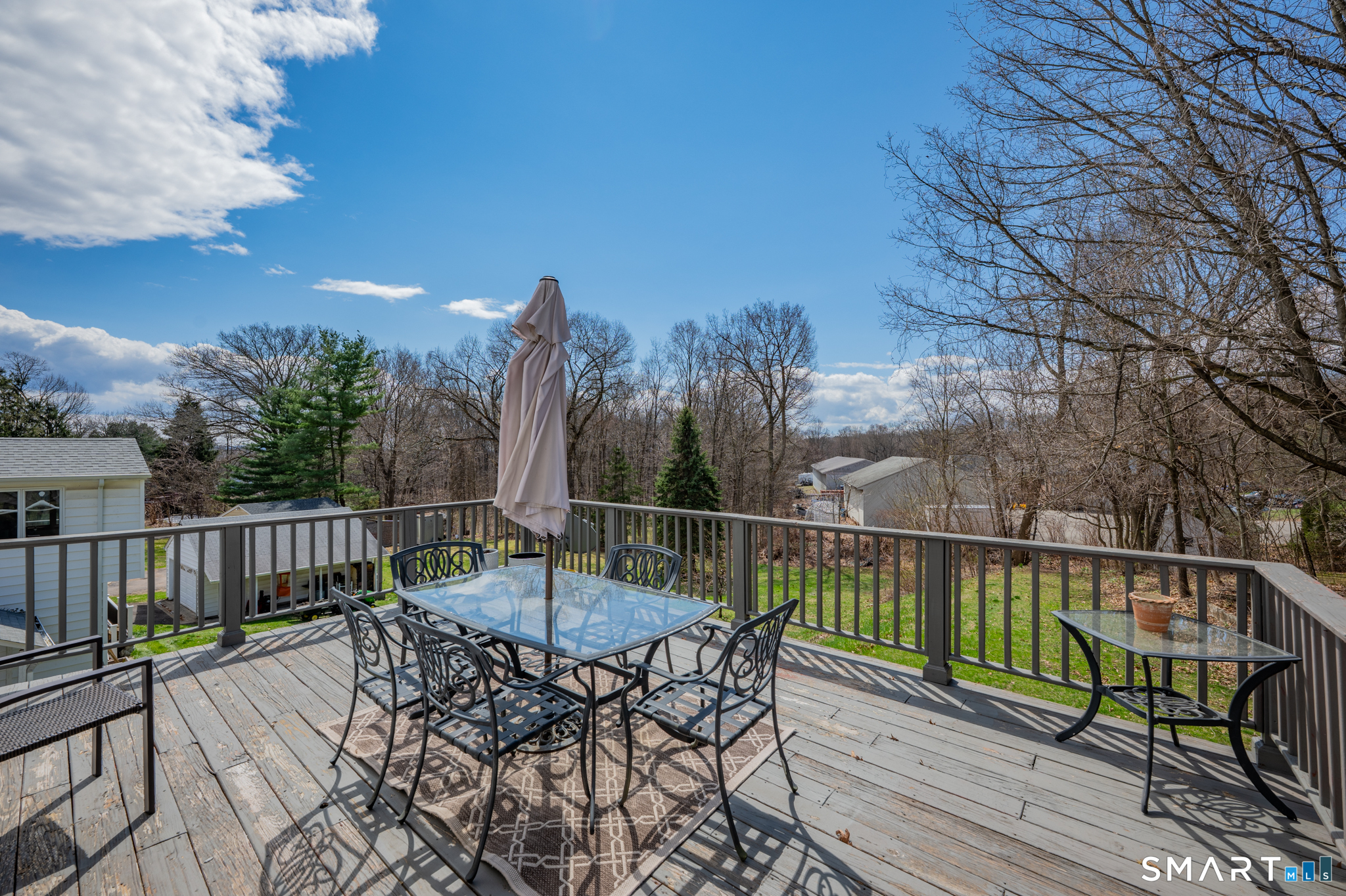 412 Reservoir Avenue Meriden, CT 06451 - Photo 24 of 32 a view of a chair and table on the deck
