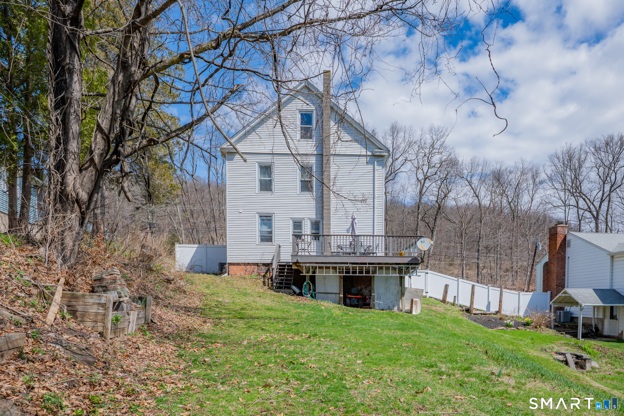 412 Reservoir Avenue Meriden, CT 06451 - Photo 25 of 32 a view of house with yard and trees in the background