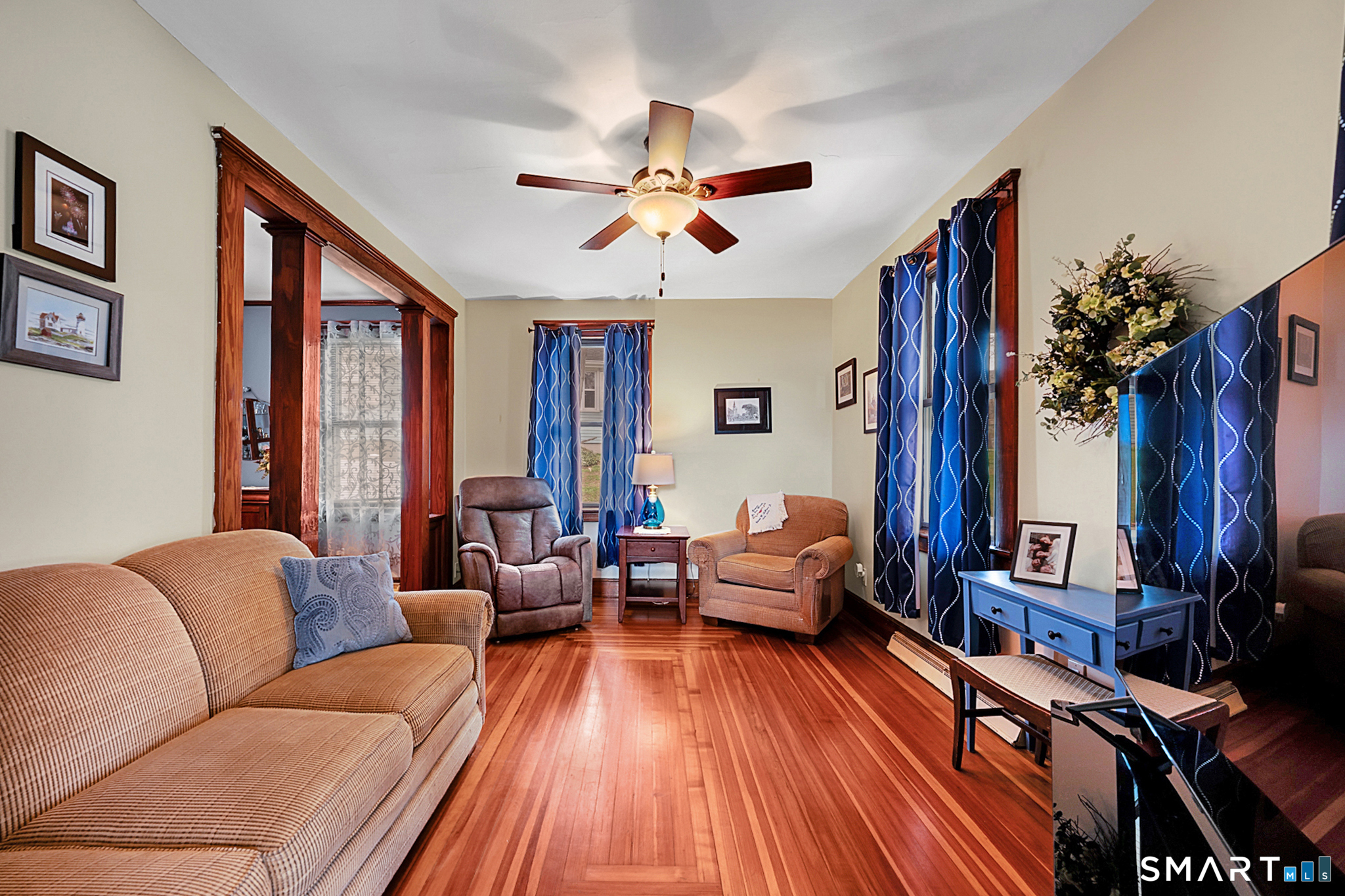 412 Reservoir Avenue Meriden, CT 06451 - Photo 7 of 32 a living room with furniture a large window and wooden floor