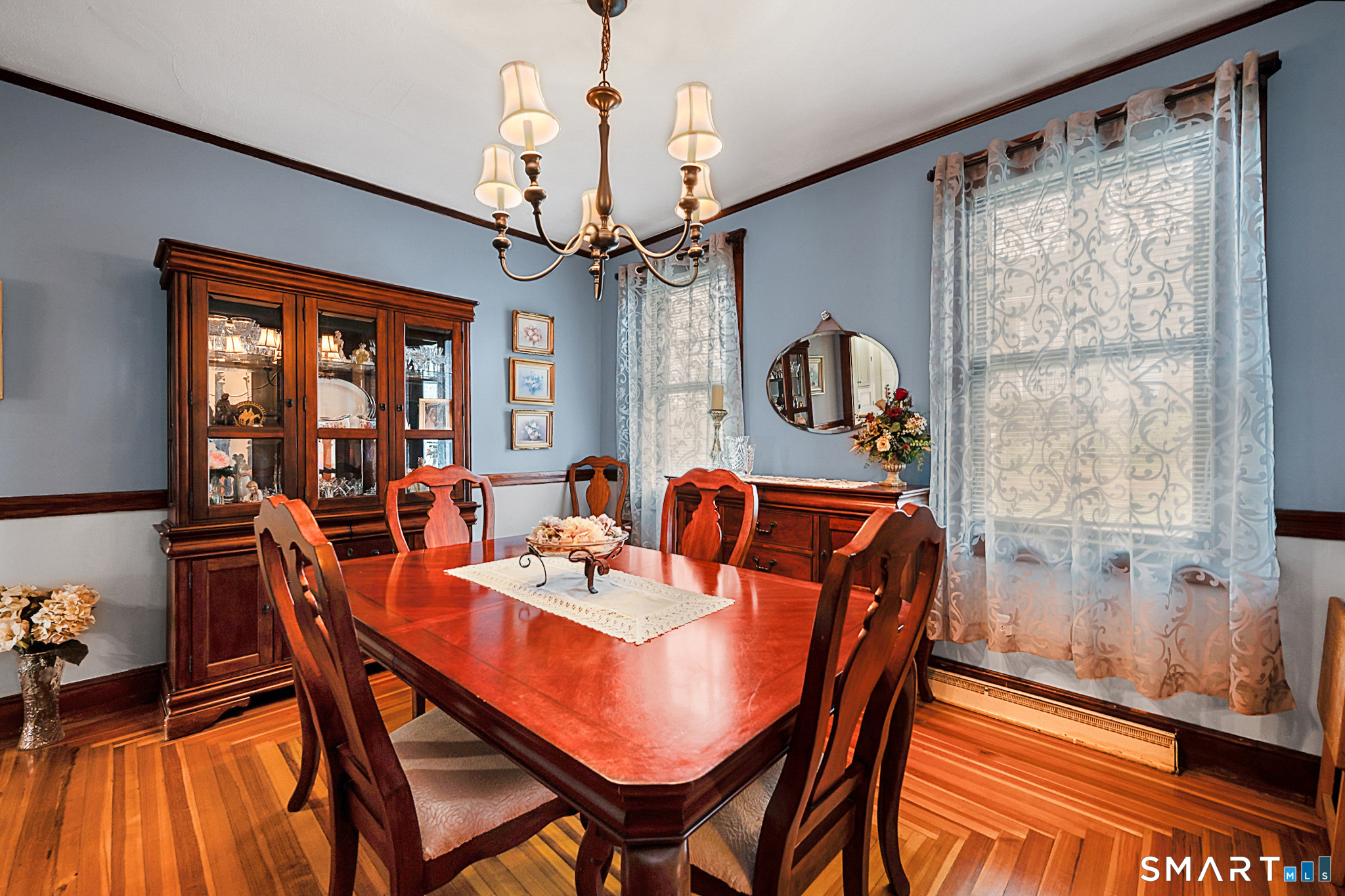 412 Reservoir Avenue Meriden, CT 06451 - Photo 9 of 32 a dining room with furniture a chandelier and wooden floor