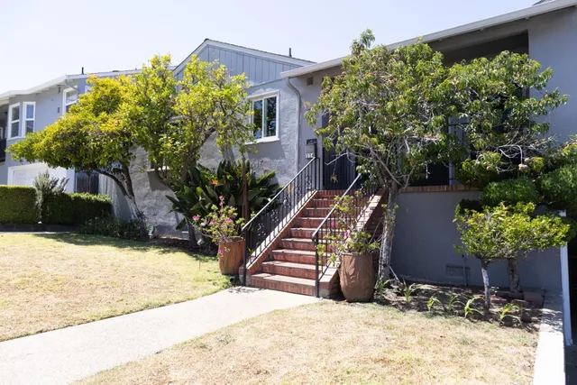 a view of a house with a yard and a yard