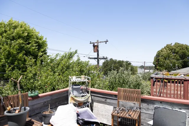 a view of a patio with a table and chairs
