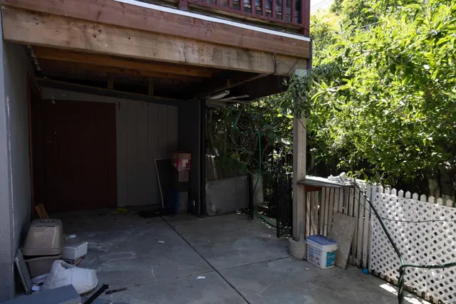 a view of a chair and table in the patio