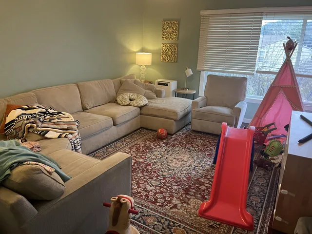 a living room with furniture and a couch