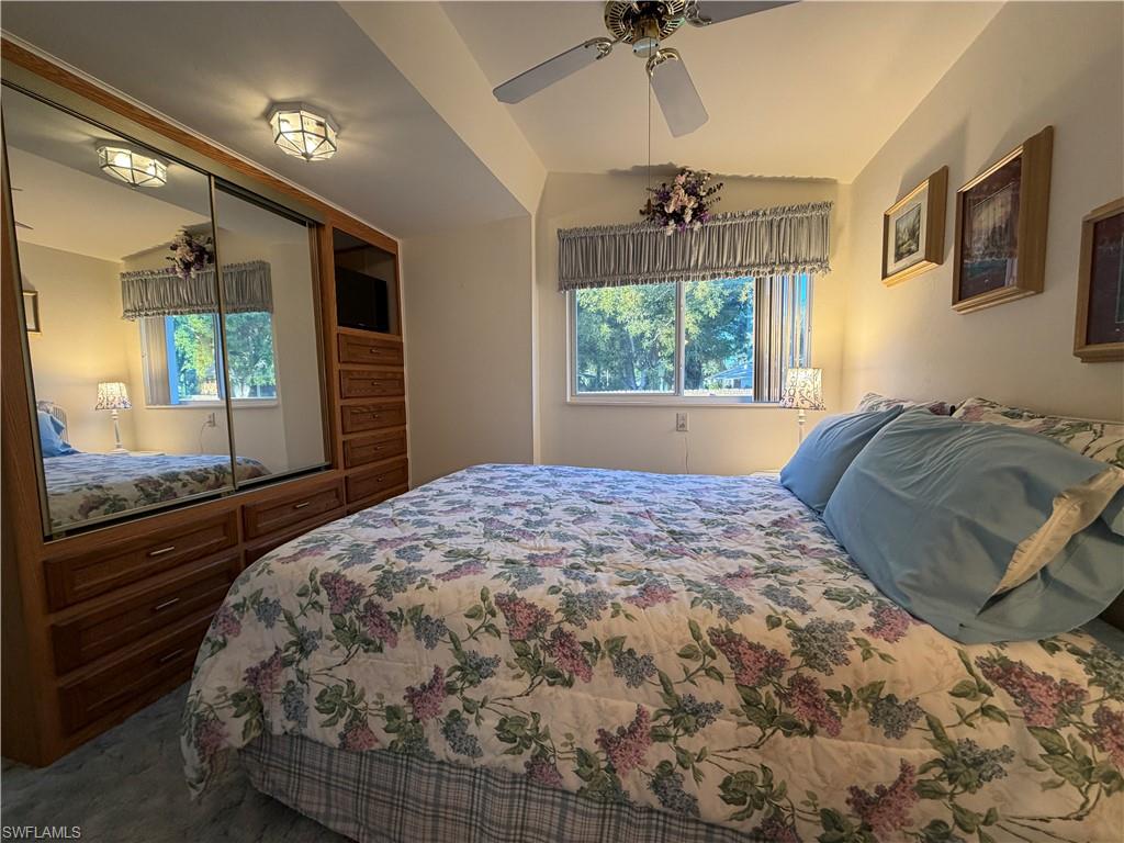 4680 Washington Way West Estero, FL 33928 - Photo 13 of 19 a bedroom with a large bed and a window