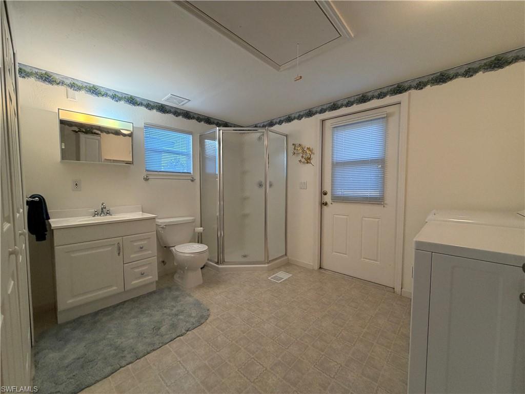 4680 Washington Way West Estero, FL 33928 - Photo 14 of 19 a bathroom with a toilet sink and shower