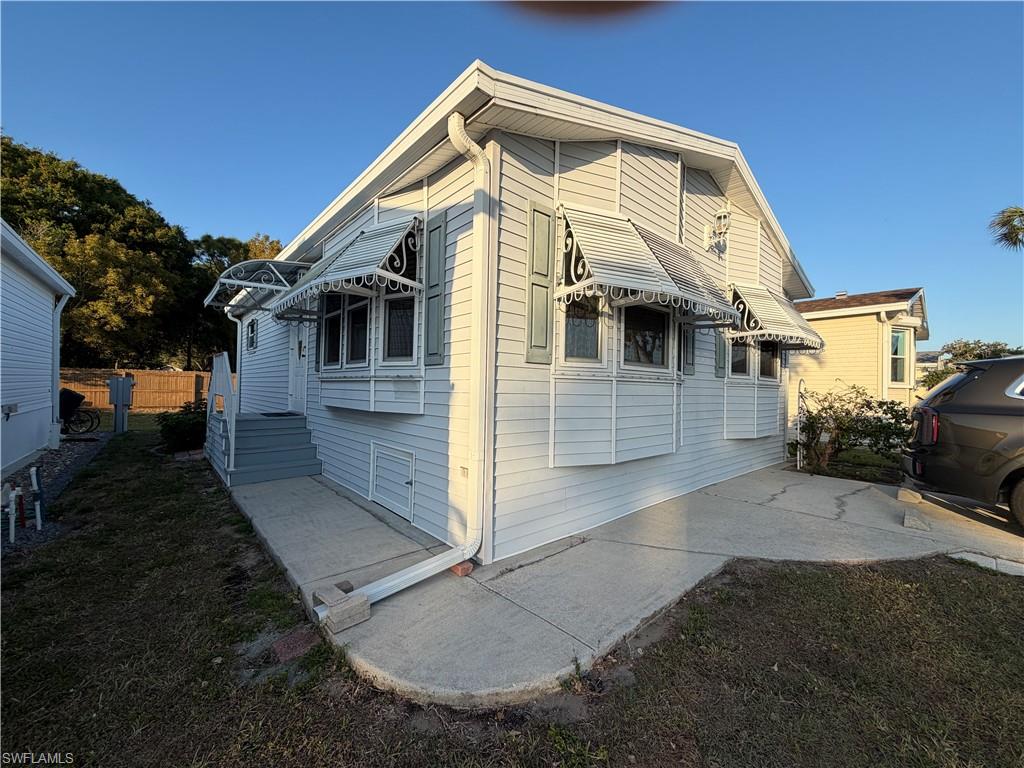 4680 Washington Way West Estero, FL 33928 - Photo 18 of 19 a view of a back yard of the house