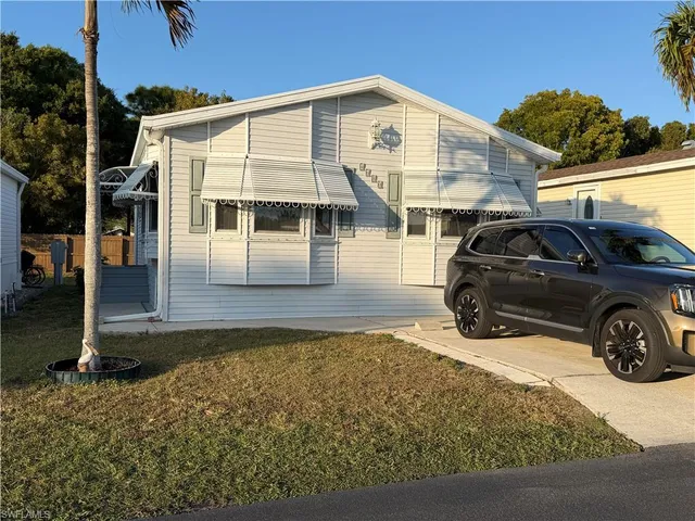 a view of a car parked in front of a house