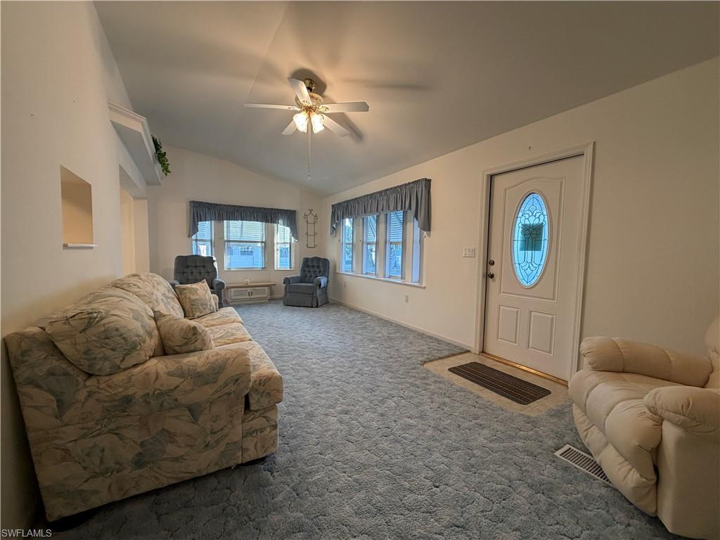 4680 Washington Way West Estero, FL 33928 - Photo 5 of 19 a living room with furniture and a flat screen tv